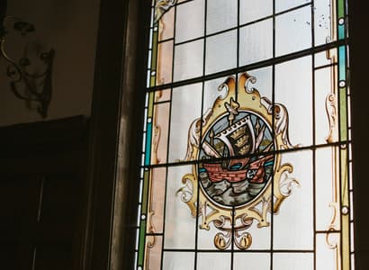 Interior shot of the Council Chambers showing stained glass window