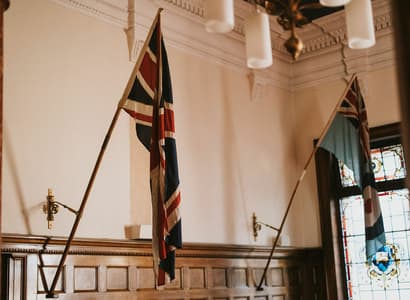 Interior shot of the Council Chambers showing flags